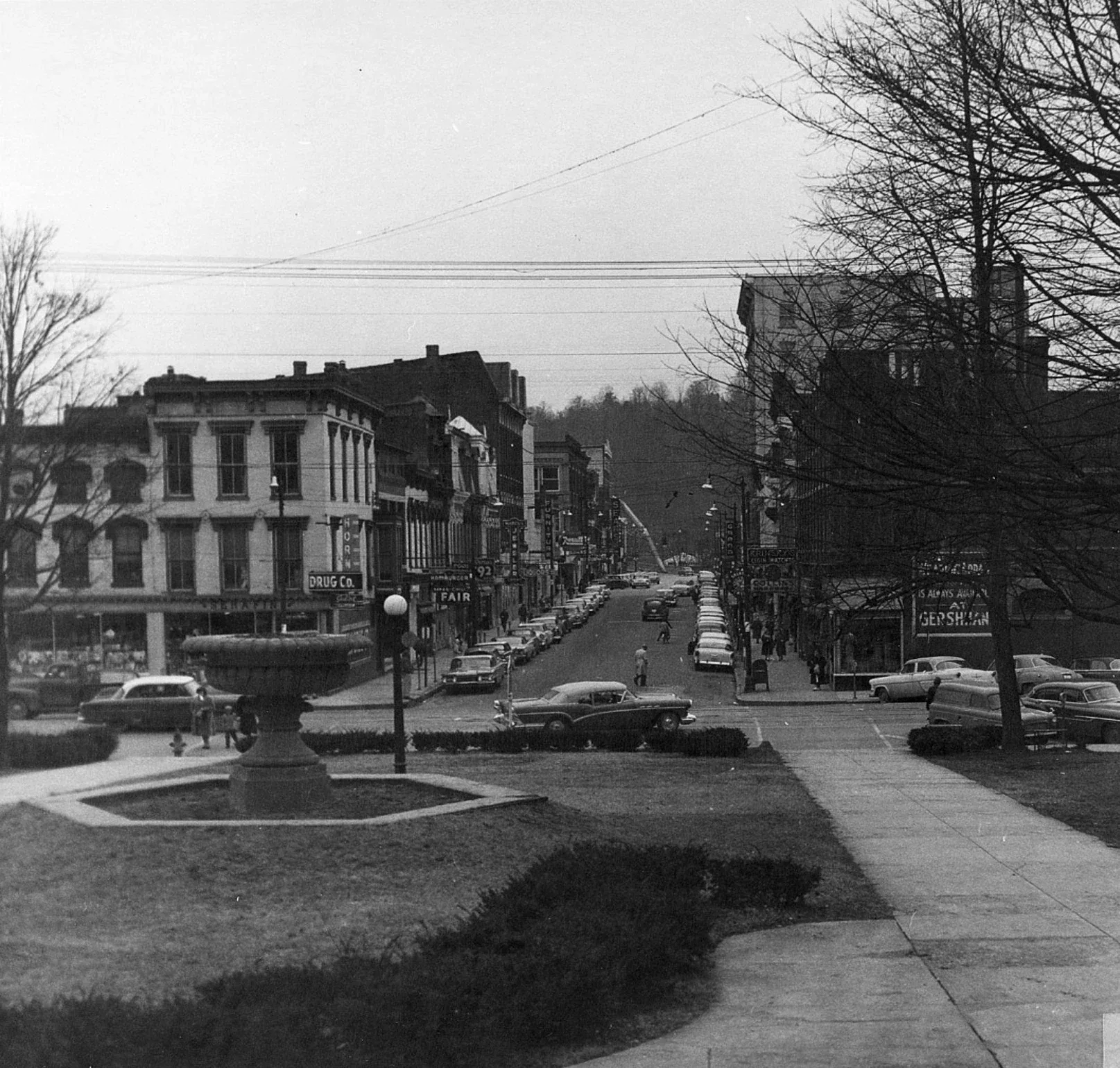 Historic St. Clair Street downtown view from Capitol, lined shops and vintage cars, quiet town scene